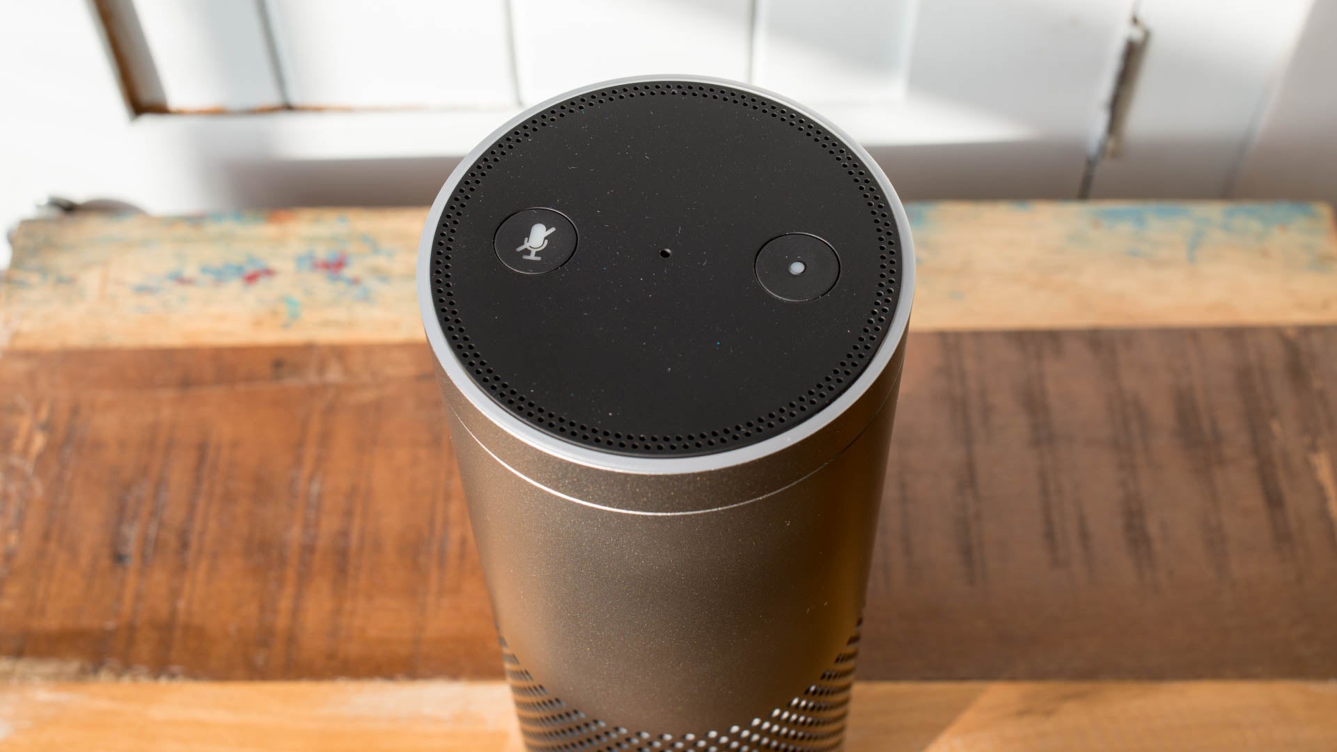 Amazon Echo Plus on wooden table near window