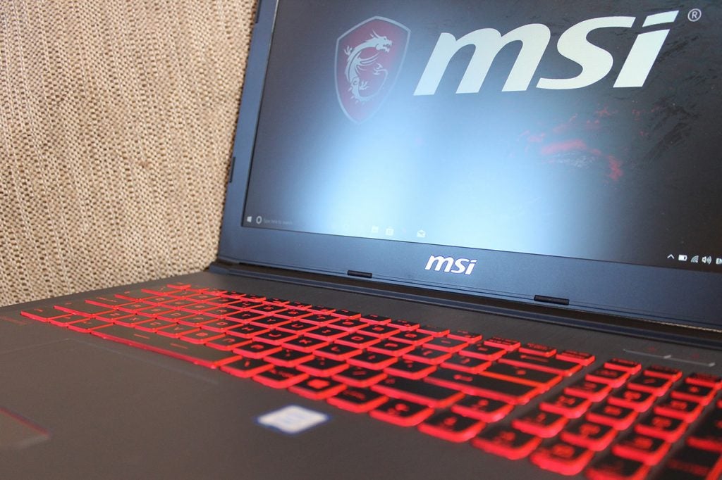 MSI GV62 7RC laptop with red backlit keyboard and logo.