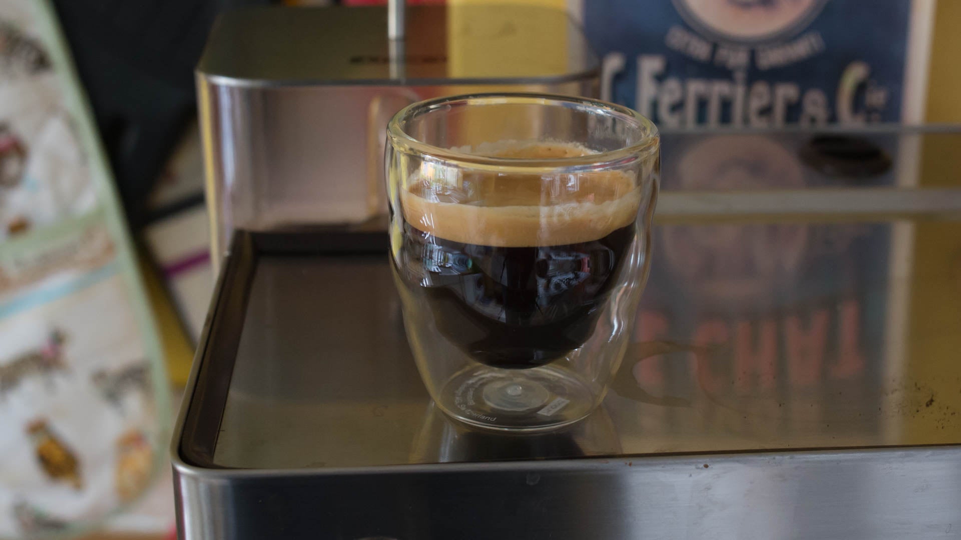 Espresso shot in glass cup on Lelit Kate coffee machine.