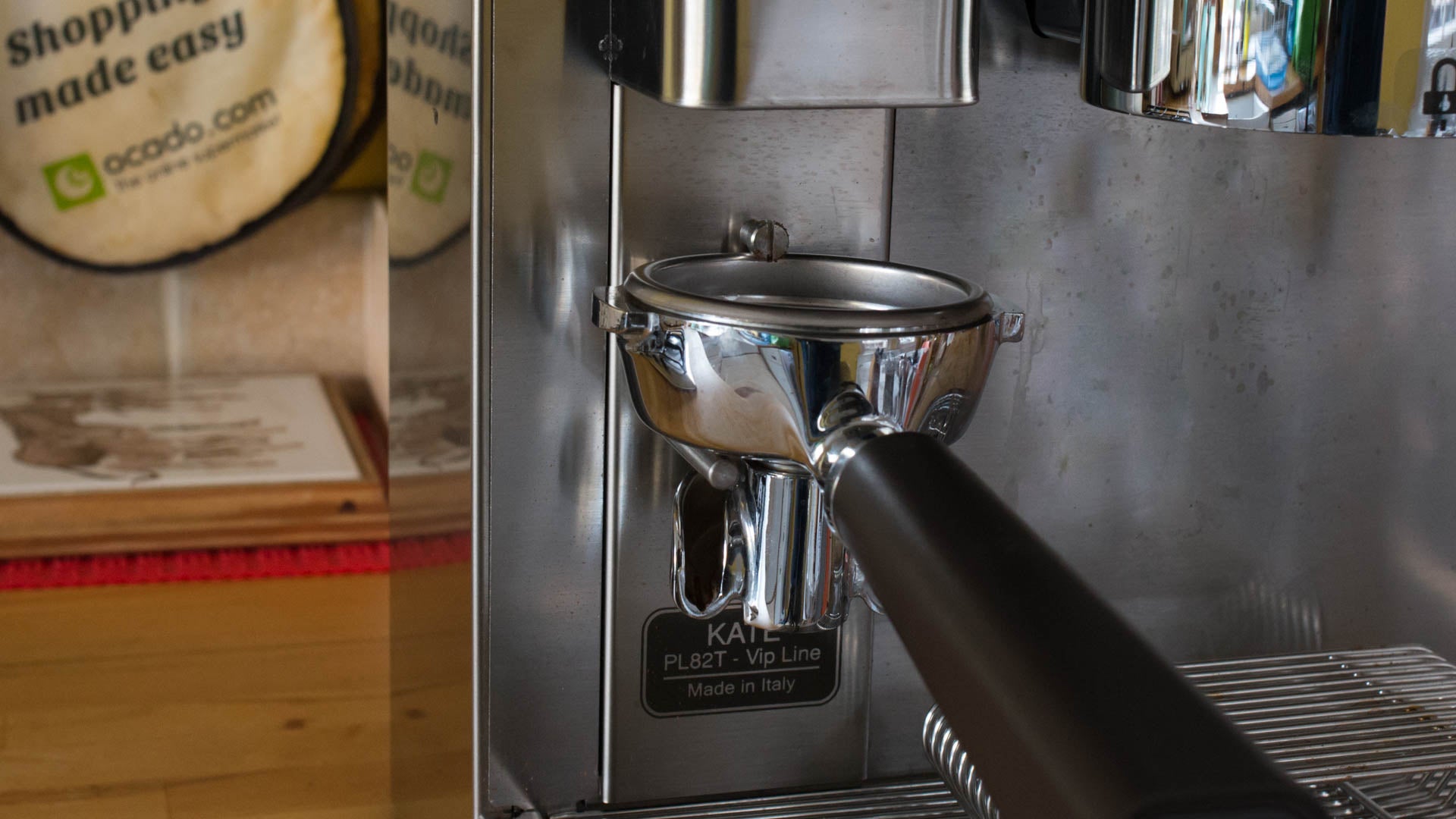 Lelit Kate espresso machine with portafilter attached.