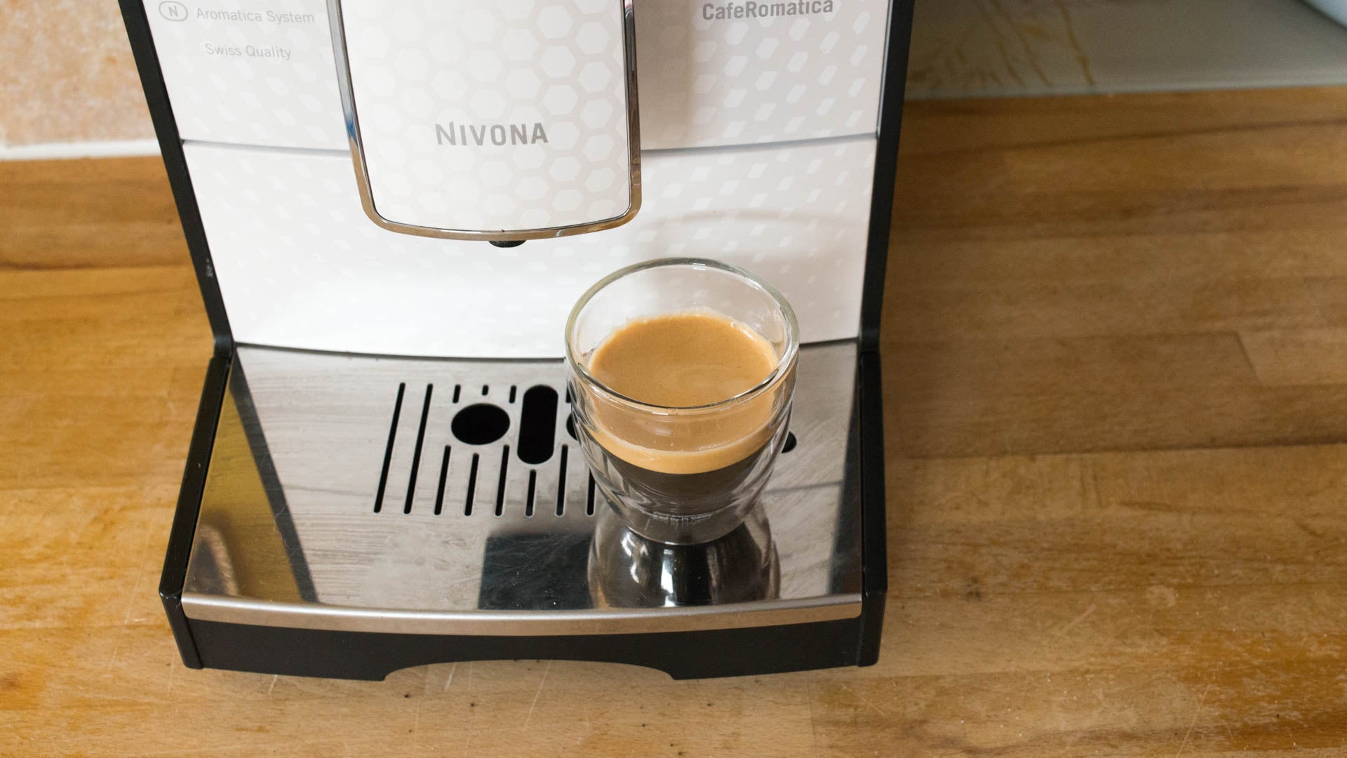 Nivona CafeRomatica 778 coffee machine with an espresso shot.