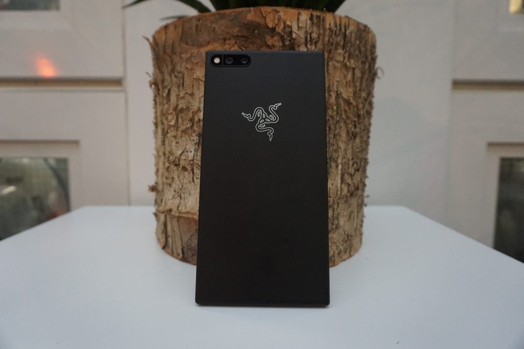 Razer Phone lying on a textured black surface.