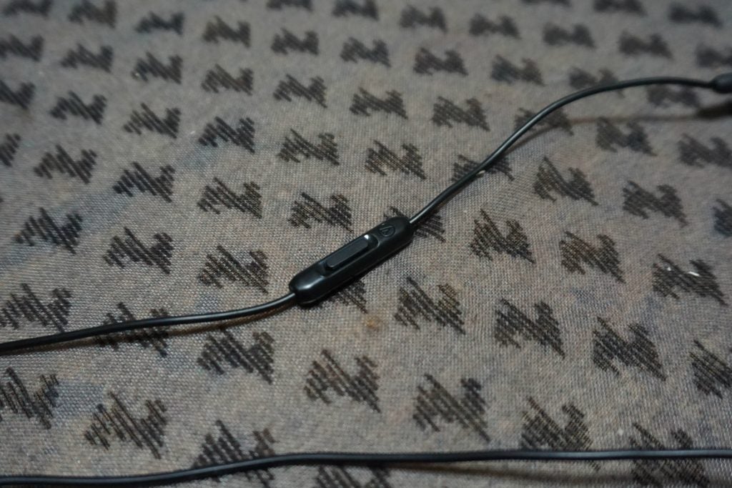 In-line remote and microphone of Audio-Technica ATH-LS70iS earphones.