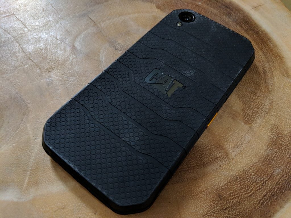 CAT S41 smartphone on a wooden surface.