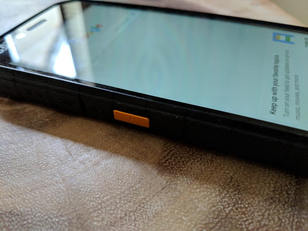 CAT S41 smartphone lying on a textured surface.