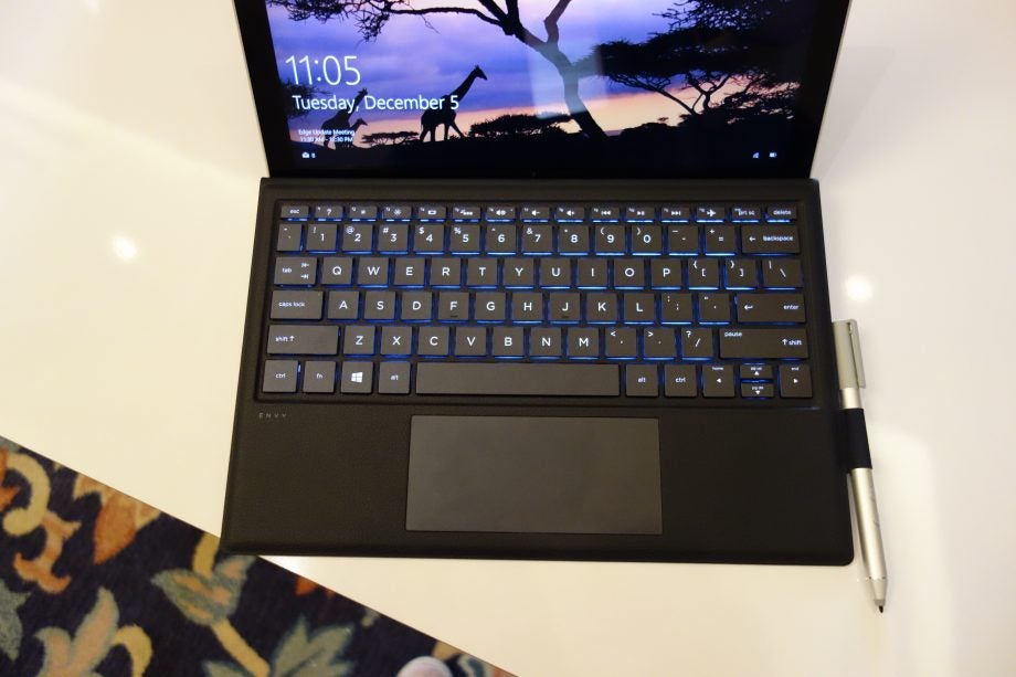 HP Envy x2 laptop with keyboard and stylus pen.