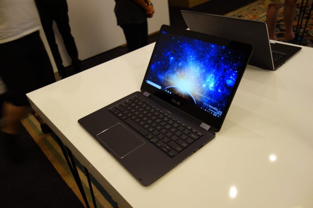 Asus NovaGo laptop on display with cosmic wallpaper