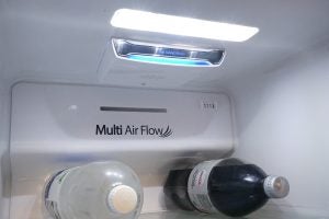 Interior view of Hisense fridge with LED light and Multi Air Flow feature.