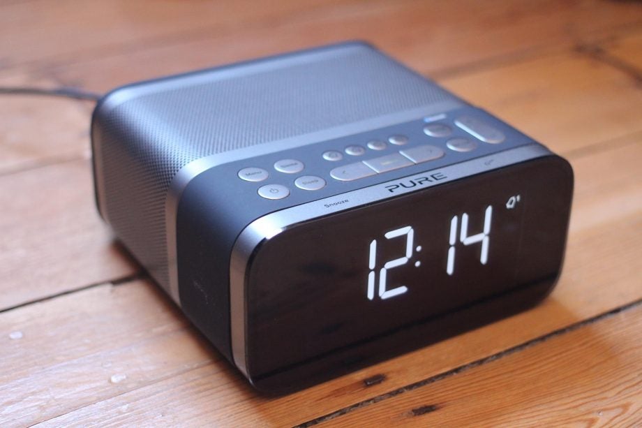Pure Siesta S6 digital alarm clock on wooden surface.