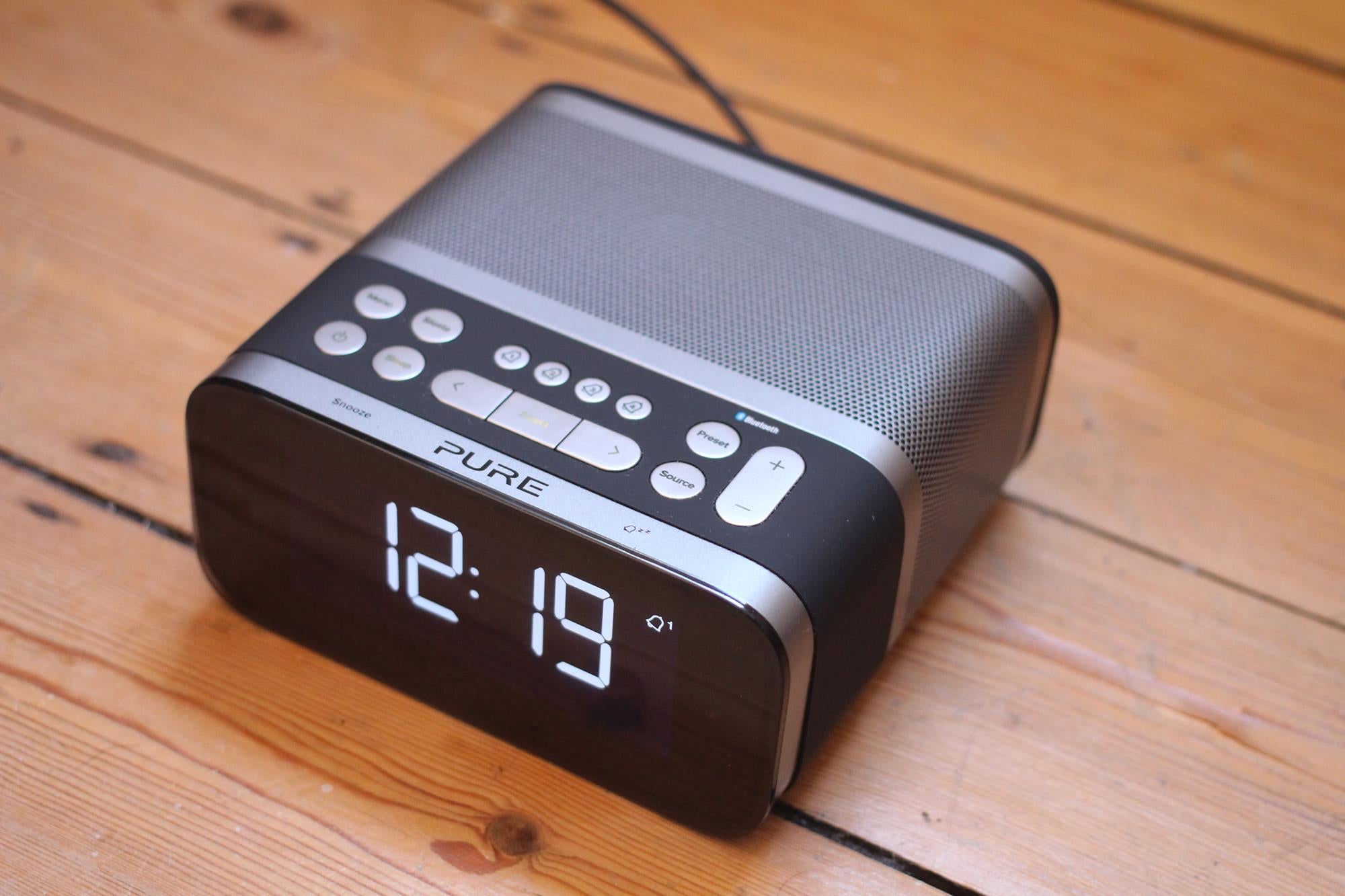 Pure Siesta S6 DAB Radio on Wooden Table Showing Time