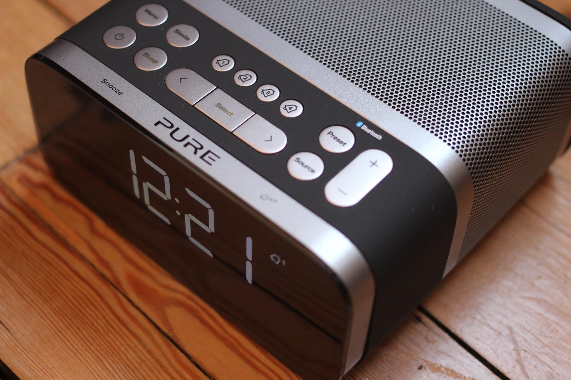Pure Siesta S6 digital alarm clock radio on wooden surface