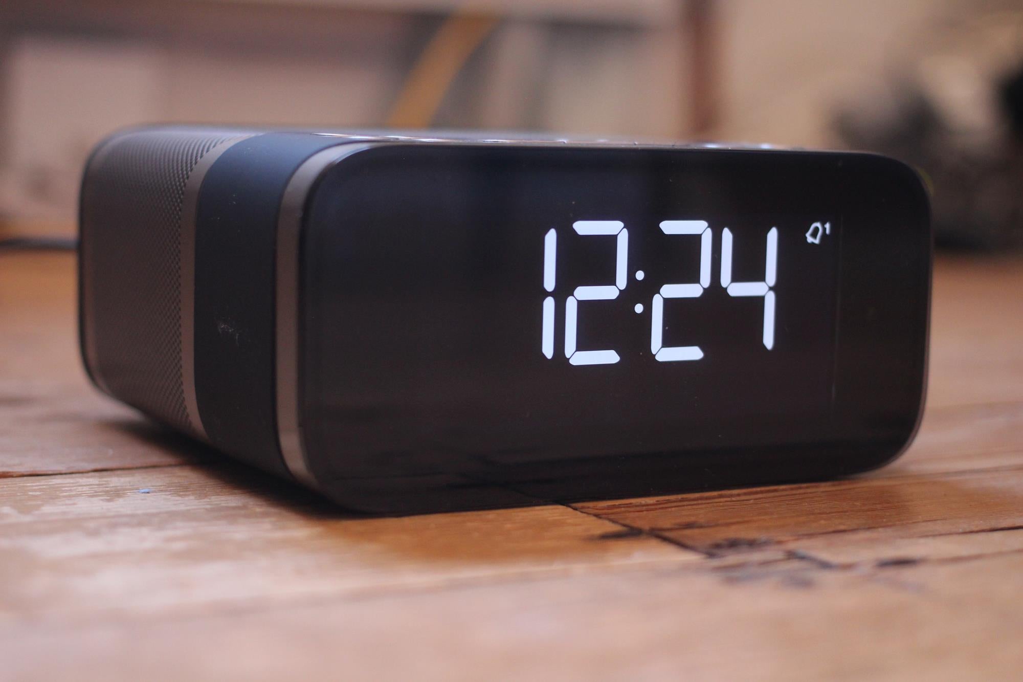 Pure Siesta S6 alarm clock displaying time on wooden surface