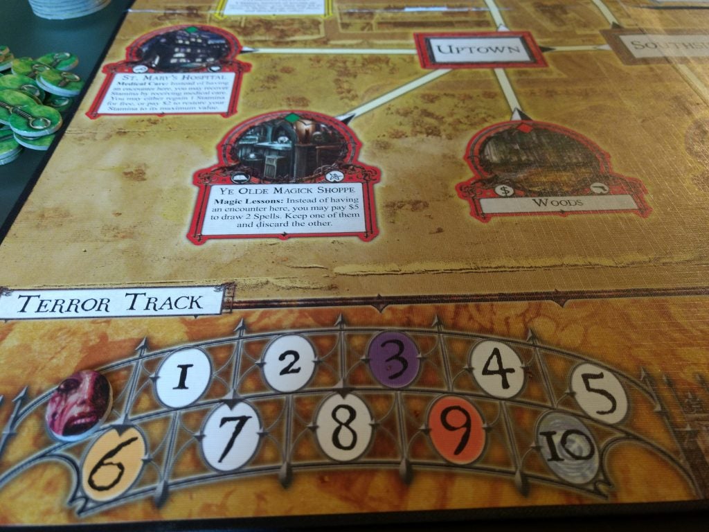 Arkham Horror board game in play with visible Terror Track.