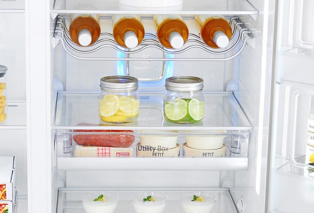 Interior view of LG GSX961NSAZ fridge freezer with food items.