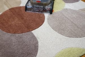 Bissell StainPro 10Bissell StainPro 10 cleaner in use on a patterned carpet.