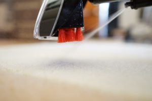 Bissell StainPro 10Bissell StainPro 10 carpet cleaner in action on carpet.