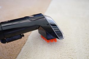 Bissell StainPro 10Bissell StainPro 10 carpet cleaner nozzle on cream carpet.