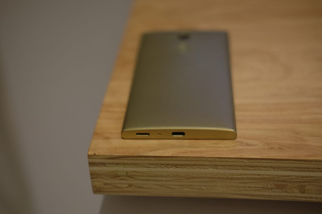 Sony Xperia L2 smartphone lying on a wooden surface.