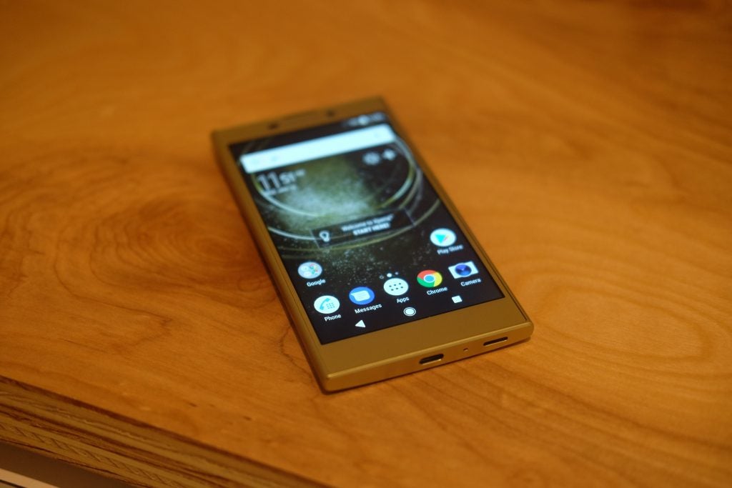 Sony Xperia L2 smartphone on wooden table.