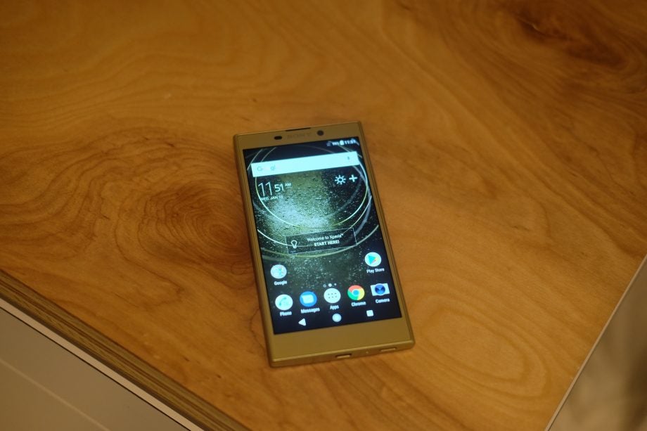 Sony Xperia L2 smartphone displayed on wooden surface.