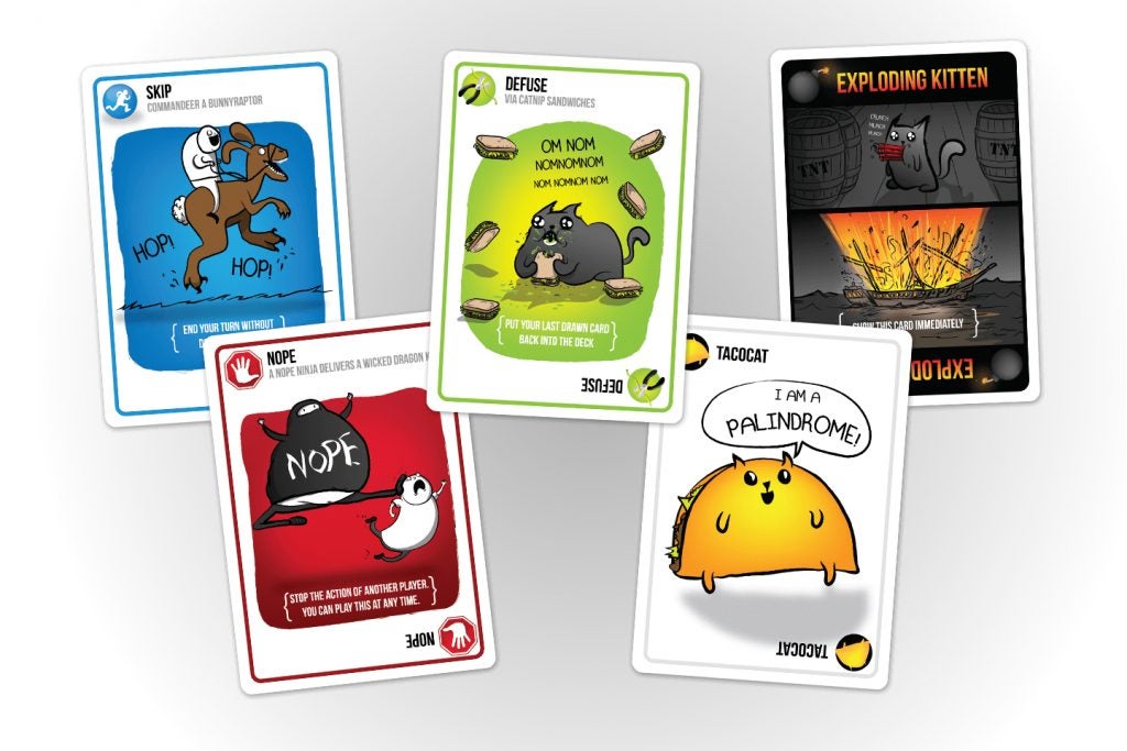 Various cards from the Exploding Kittens card game displayed.