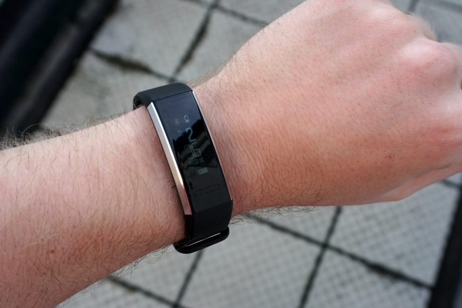 Huawei Band 2 Pro fitness tracker on a person's wrist.