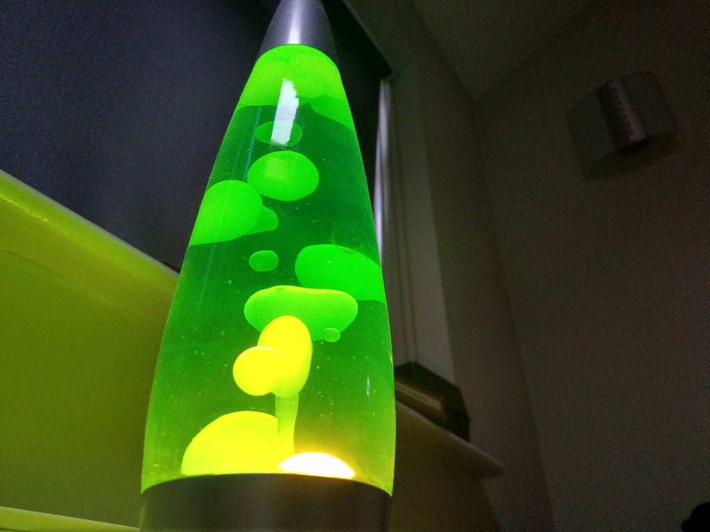 Overcast weather conditions captured in a street photographGlowing green lava lamp in a dimly lit room.