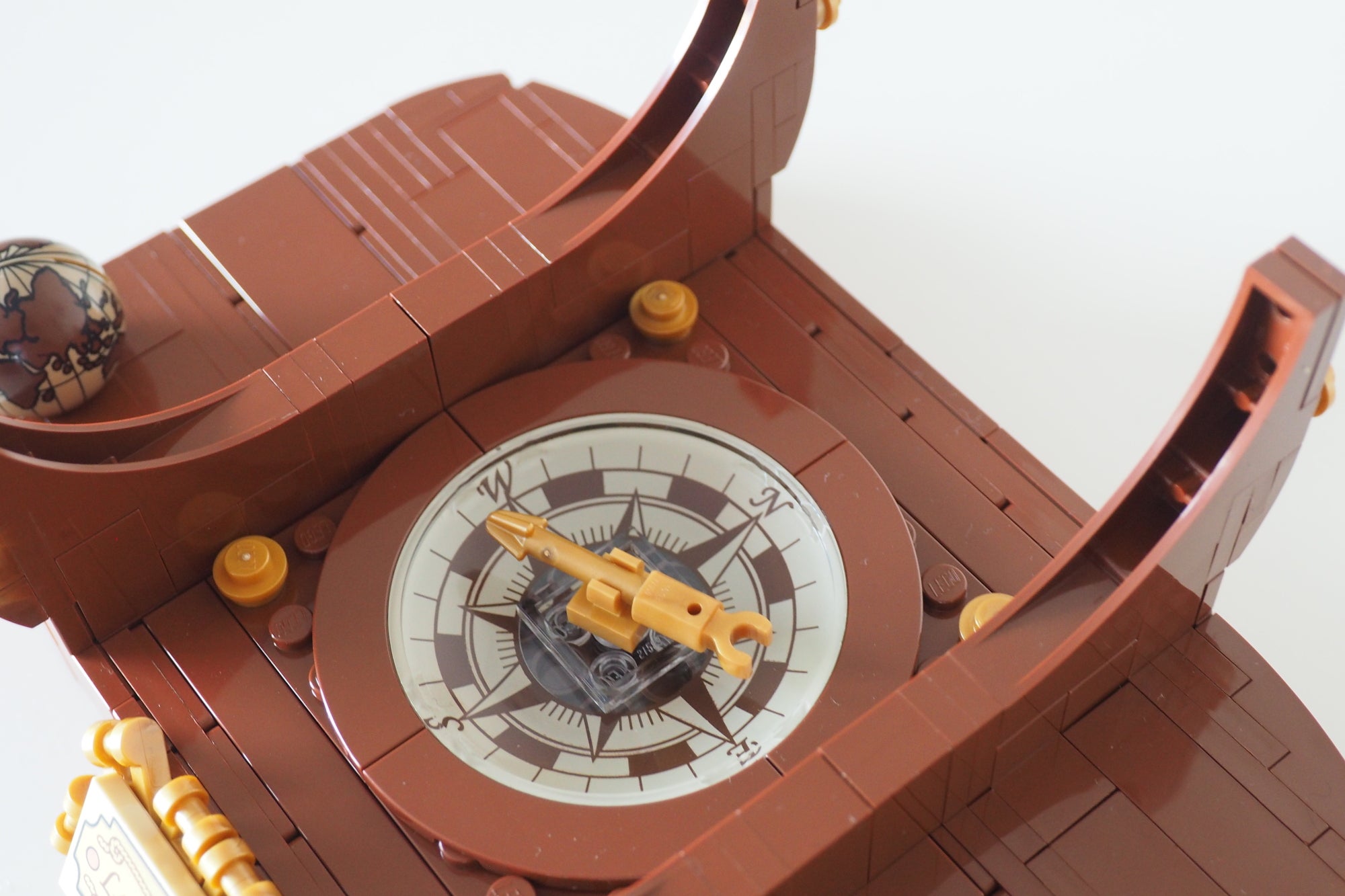 Close-up of LEGO Ship in a Bottle compass detail.