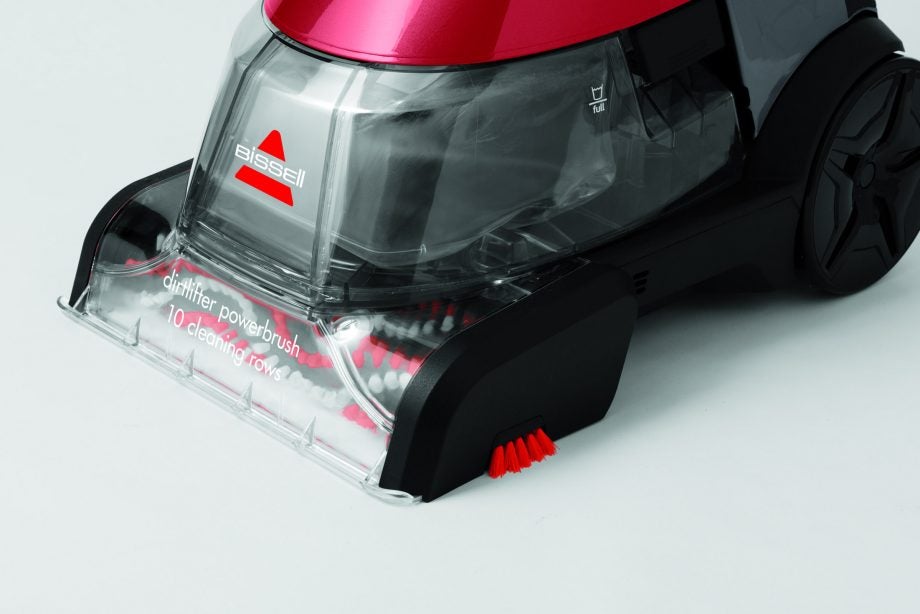 Close-up of Bissell StainPro 10 carpet cleaner head with brushes.