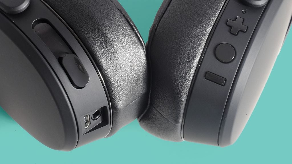 Close-up view of Skullcandy Crusher Wireless headphones controls.