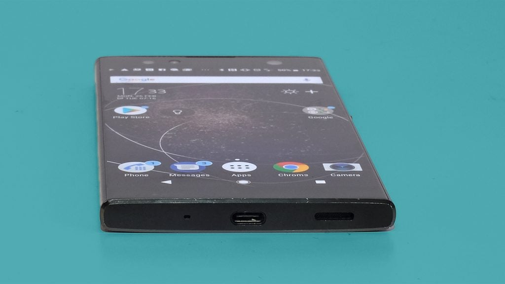 Sony XA2 Ultra smartphone on a teal background.