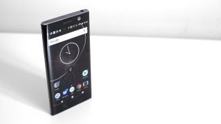 Sony Xperia XA2 smartphone on white surface.
