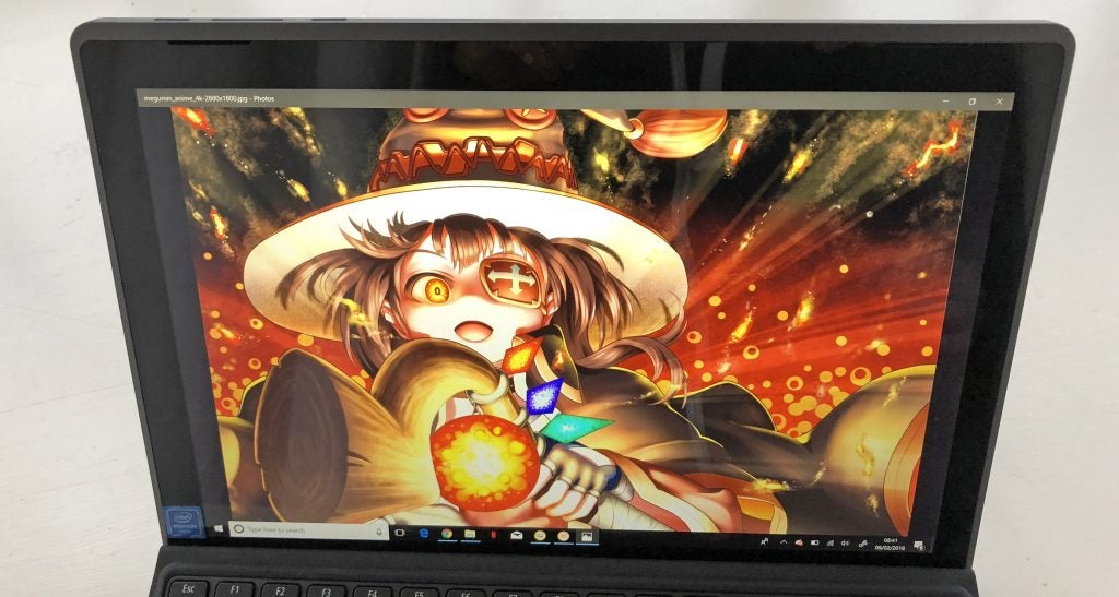 Acer Switch 3 displaying colorful anime wallpaper.