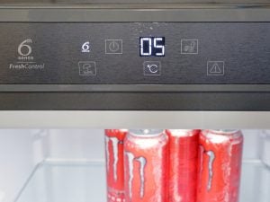 Whirlpool refrigerator control panel with temperature display at 5°C.