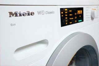 Miele W1 Classic washing machine with digital display.