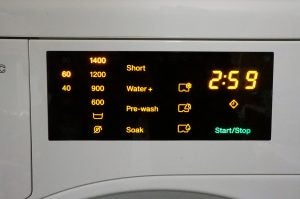 Miele WDB020 washing machine display panel with options.