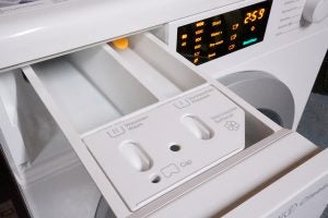 Miele WDB020 washing machine detergent drawer and control panel.