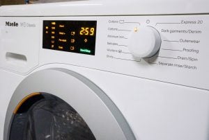Close-up of Miele WDB020 washing machine control panel.