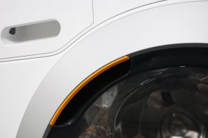 Close-up of Miele WDB020 washing machine door.