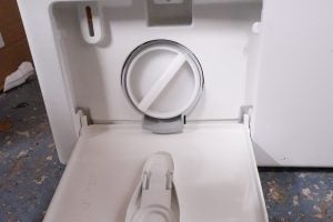 Miele WDB020 washing machine detergent compartment open.