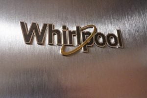 Close-up of Whirlpool logo on stainless steel appliance.