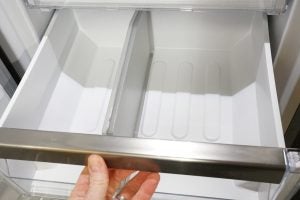 Interior view of empty Whirlpool freezer drawer.