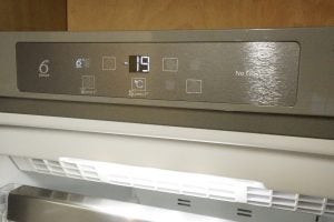 Whirlpool freezer display panel indicating temperature and functions.