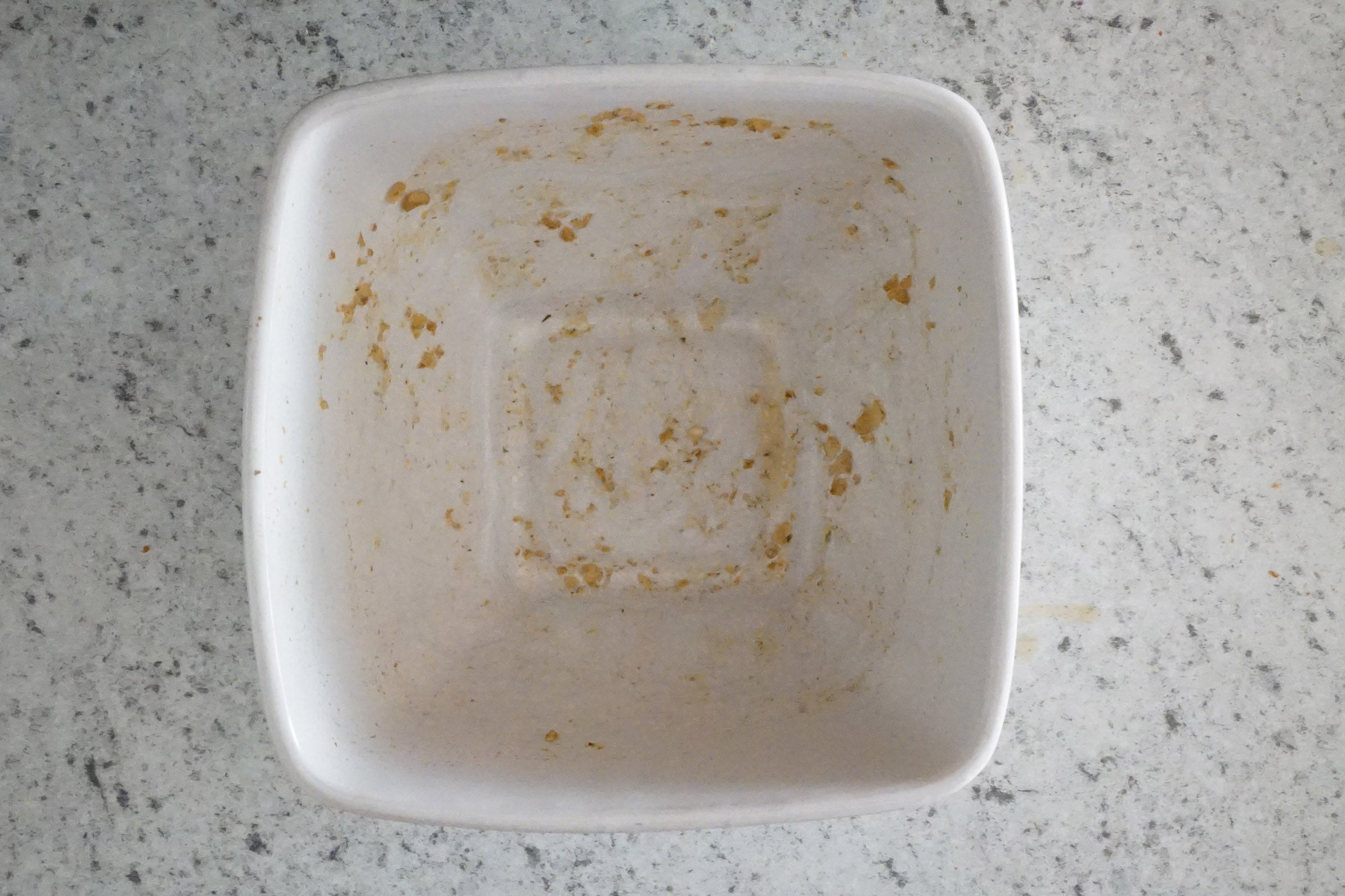 Dishwasher-tested container with remaining food stains.