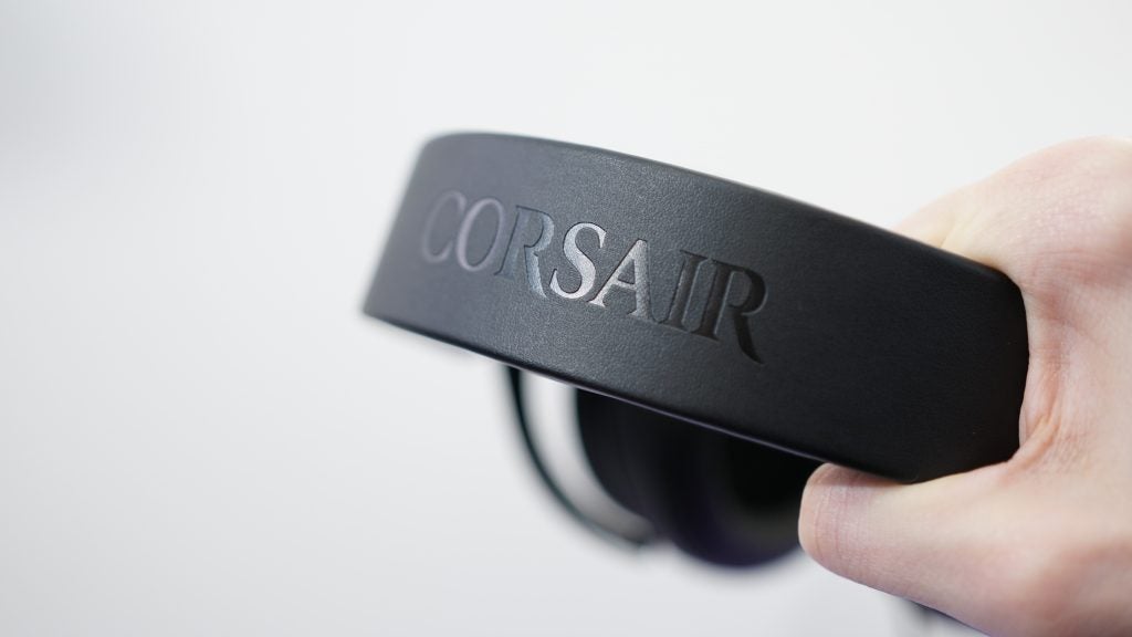 Close-up of Corsair HS50 headset held in hand.