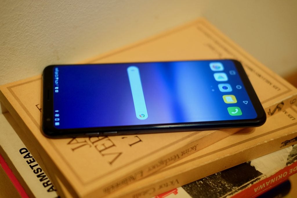 LG V30S ThinQ smartphone on a stack of books