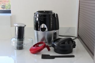 Magimix Le Duo Plus XL juicer with accessories on kitchen counter.