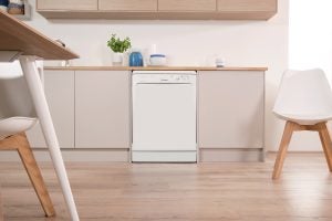 Indesit dishwasher integrated in a modern kitchen setup.