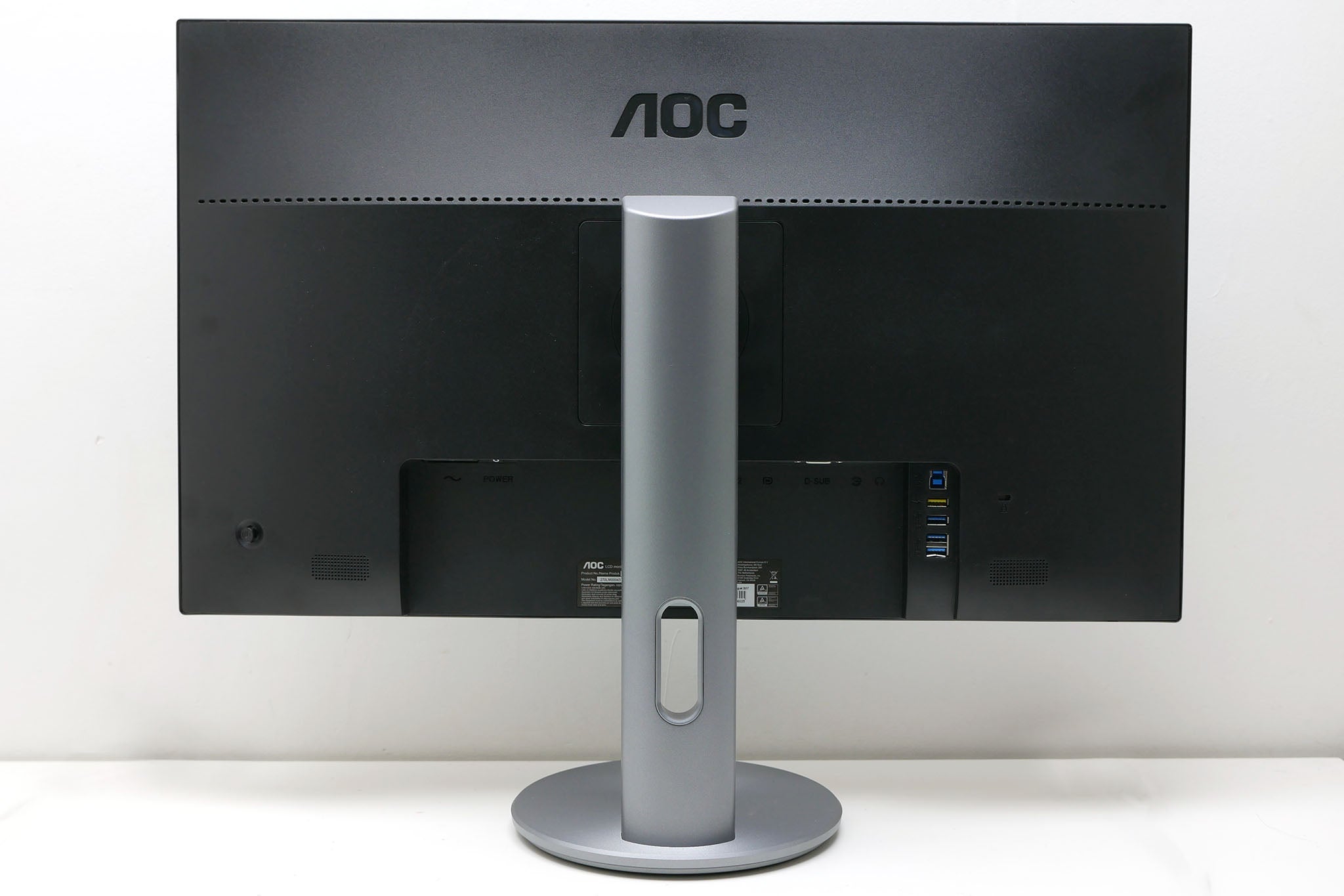 Back view of AOC Q2790PQU monitor with stand and ports.