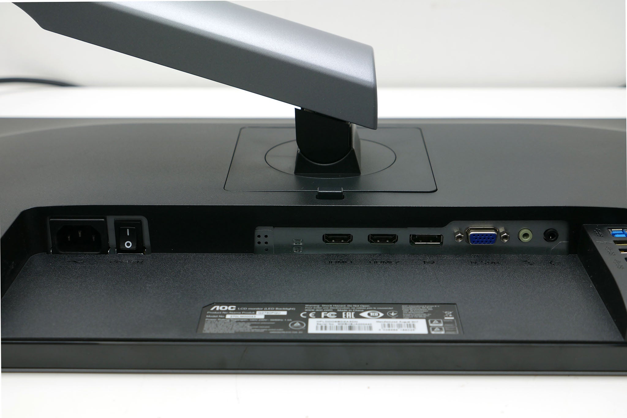 Close-up of AOC Q2790PQU monitor's connectivity ports.